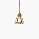 Pendel i messingglas